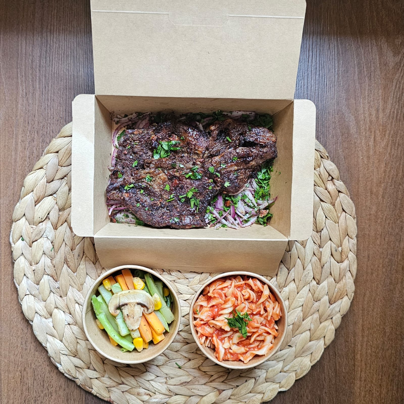 Grilled Entrecôte with red sauce pasta and sauteed veggies